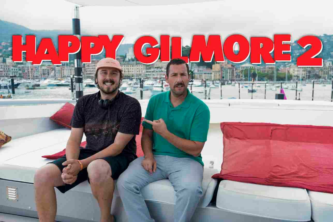 Adam Sandler pointing at Kyle Newacheck on a boat